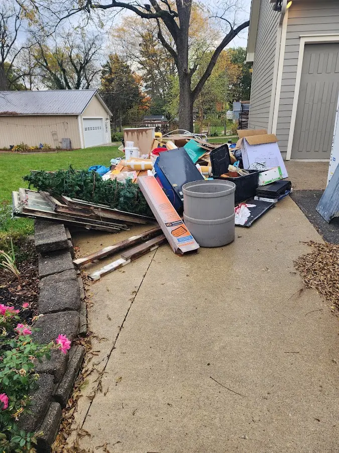 Dumpster being loaded with debris for Residential Dumpster Rental in Burke
